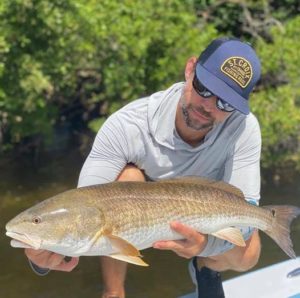 Local fishing charters can put you on Redfish while fishing in the waters around AMI